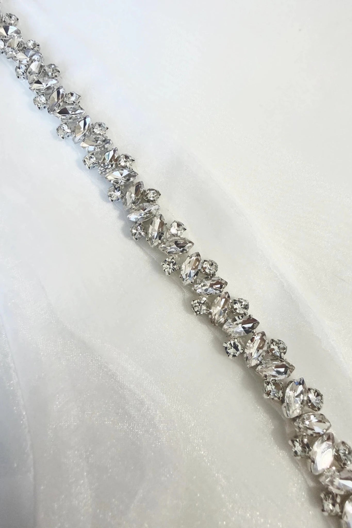 White rhinestone sheer first communion bolero, close-up, embellishment detail.
