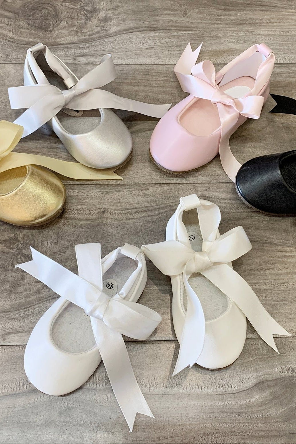 White flower girl ballerina shoes.