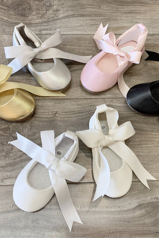 White flower girl ballerina shoes.