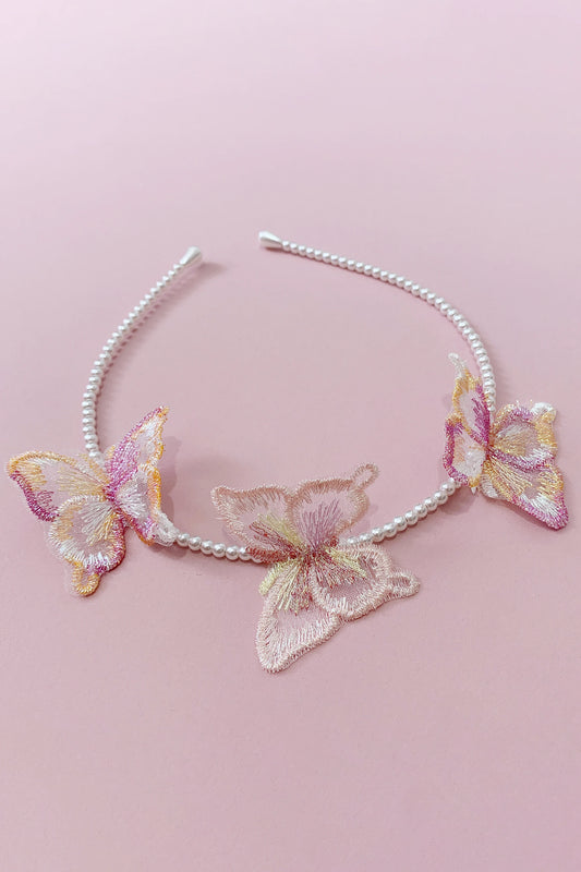 Decorative pearl headband with 3 butterflies designs on a pink background