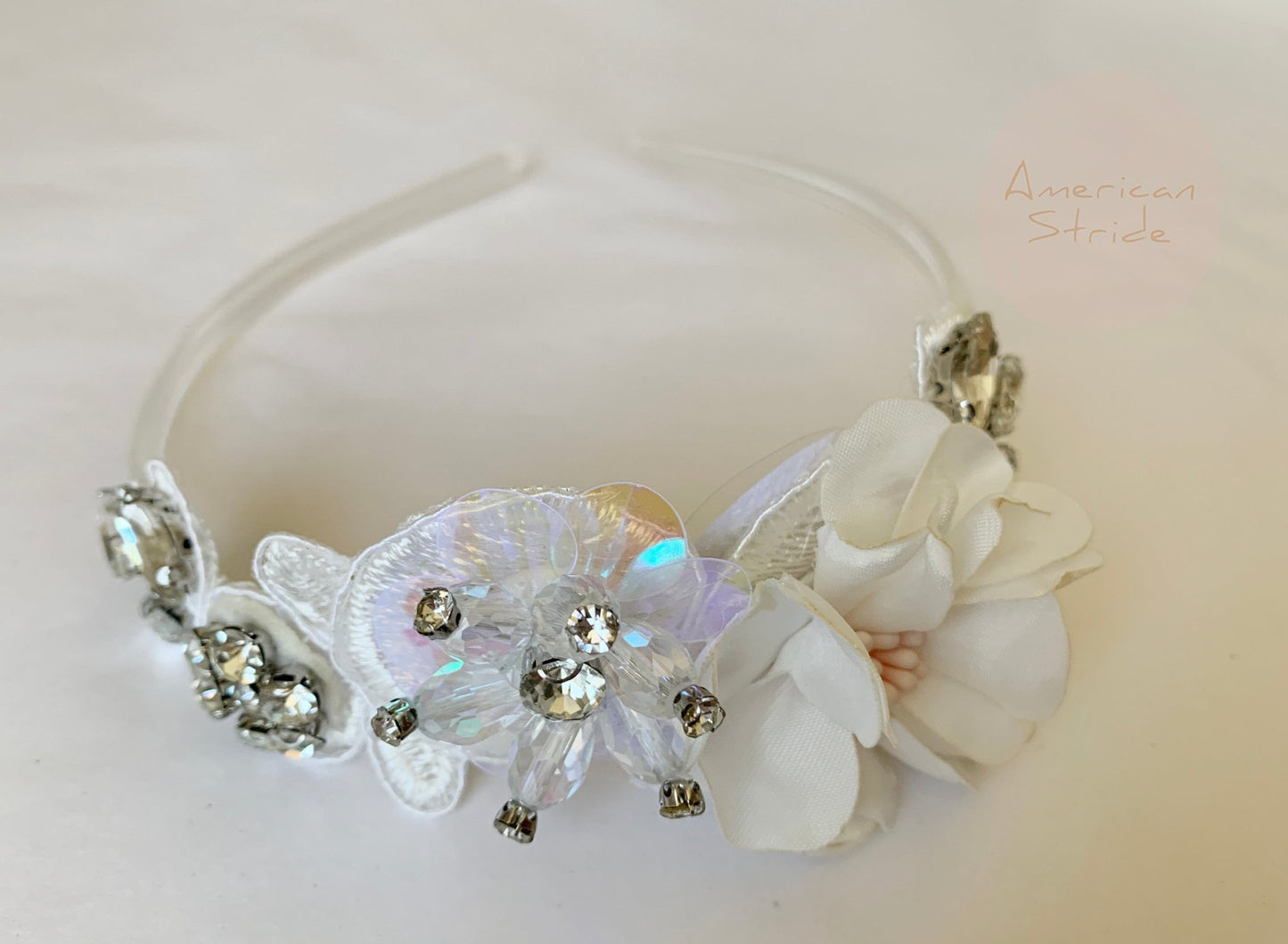Ivory rhinestone floral flower girl headband, front view.