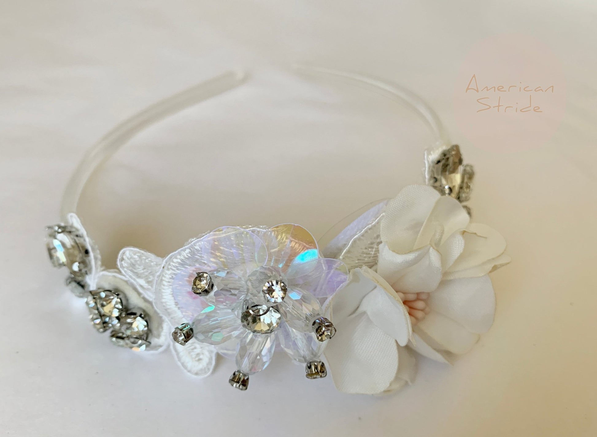 Ivory rhinestone floral flower girl headband, front view.