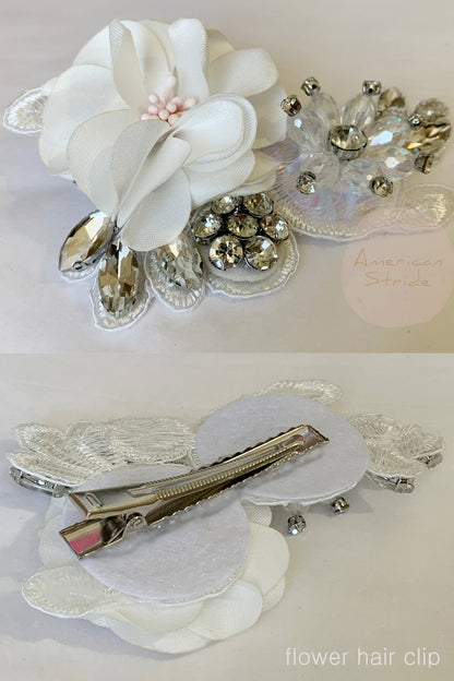Front view presents off white rhinestone floral flower girl hair clip,.
