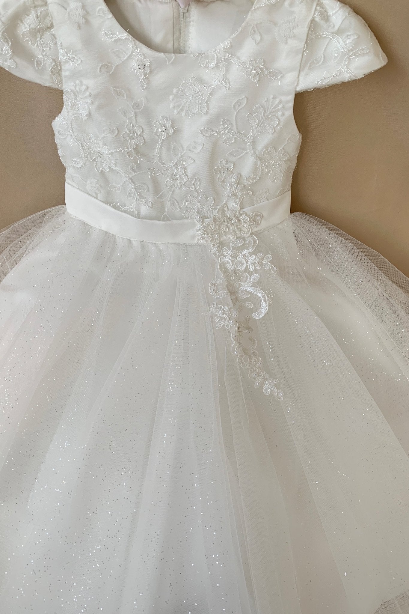 White lace flower girl dress with a belt. Also suitable as a communion dress.