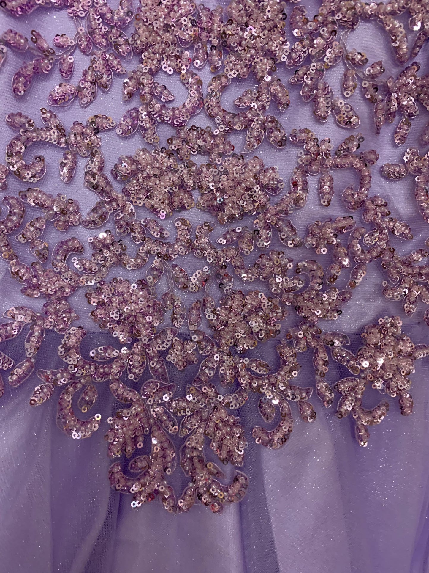 Skirt detail of a lilac kids mini quinceanera mini quince dress with layered glitter tulle fabric and detachable long train.