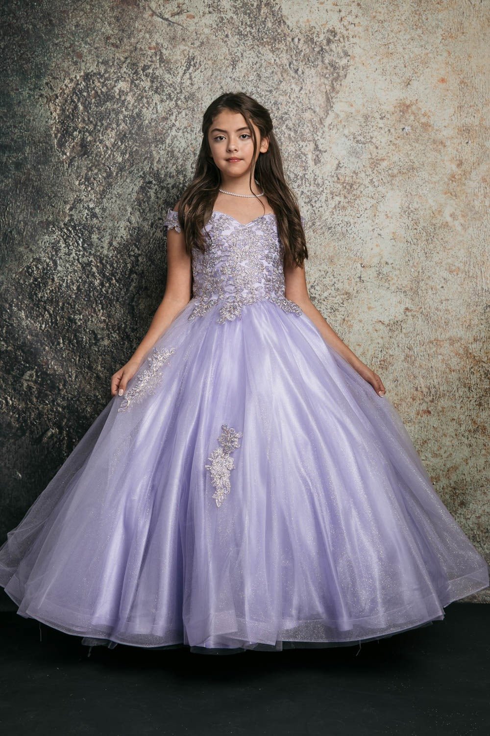 Front view of lilac kids mini quinceañera mini quince dress with off-shoulder embroidered bodice, floral detailing, and layered tulle skirt.