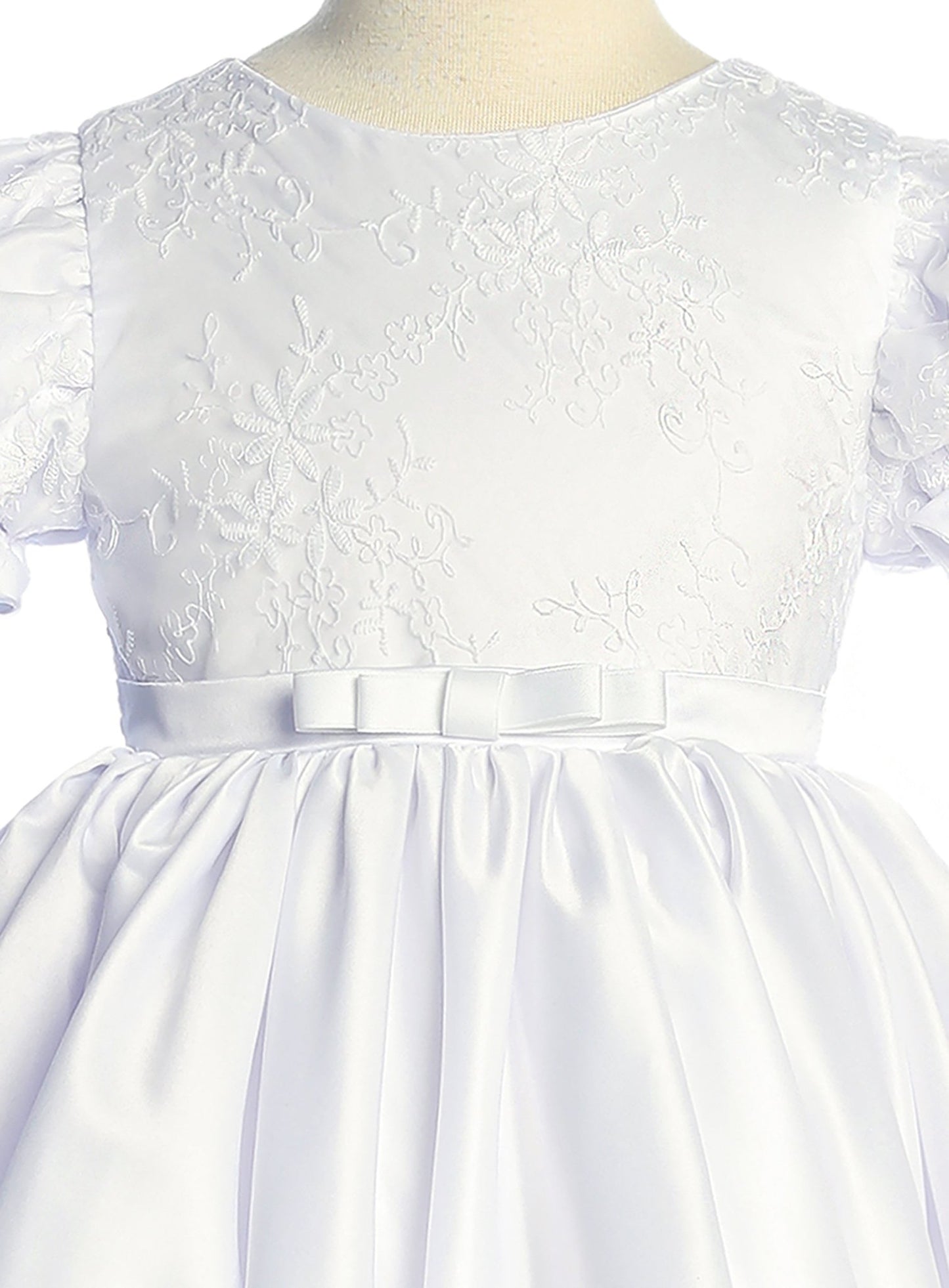 White lace flower girl dress with a belt. Also suitable as a communion dress.