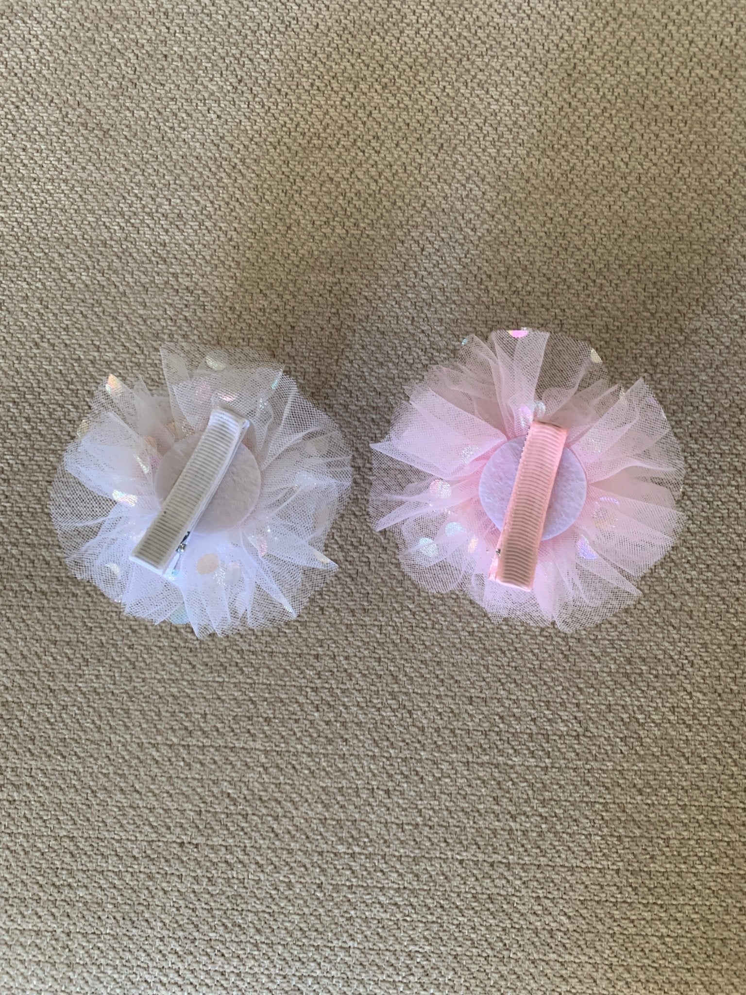 White and pink rhinestone tulle flower girl tulle crown pin, back view.