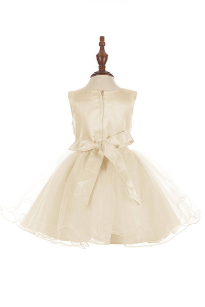 champagne dress on a mannequin against a white background