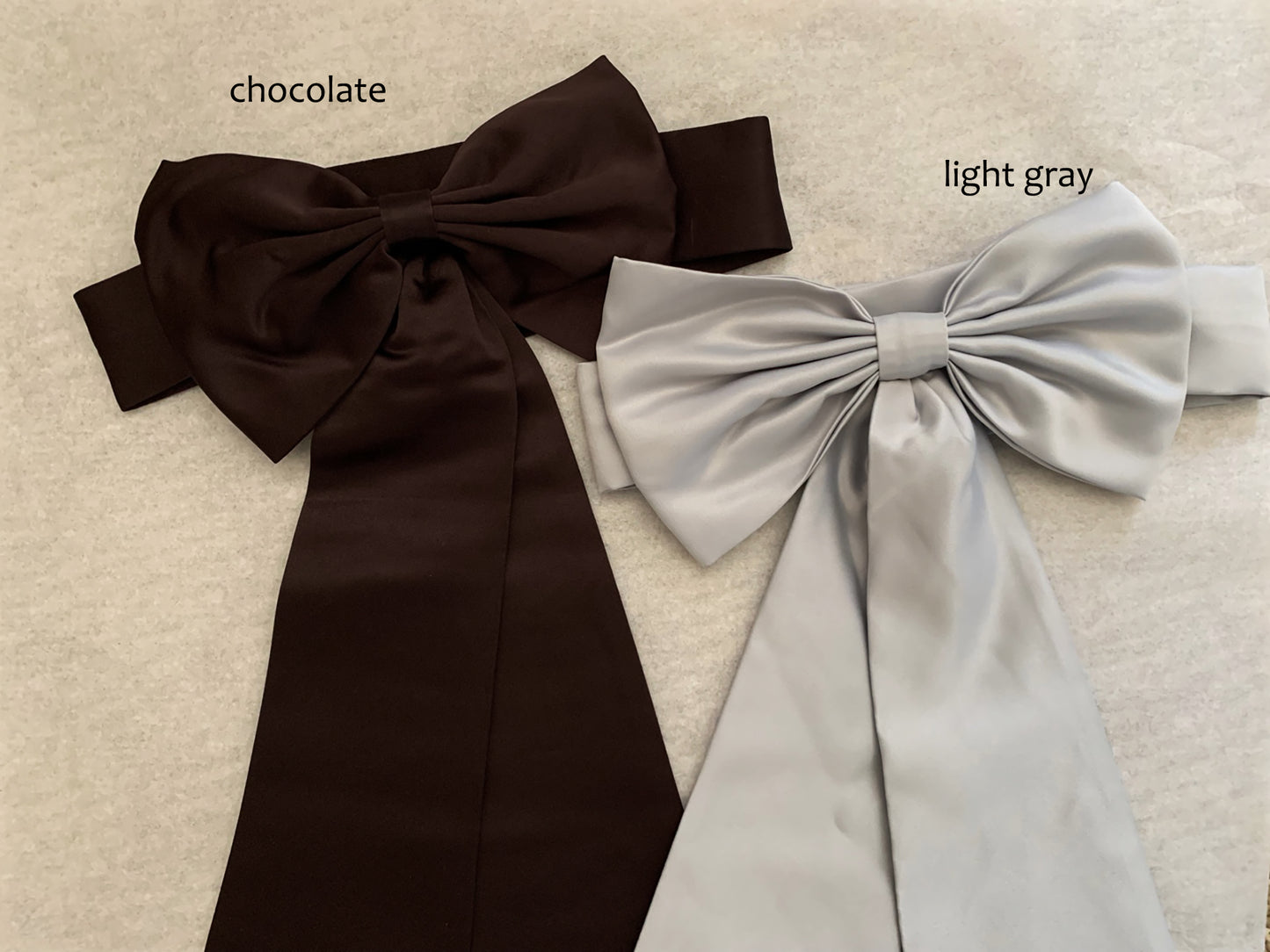 chocolate and light gray ribbons on ivory background