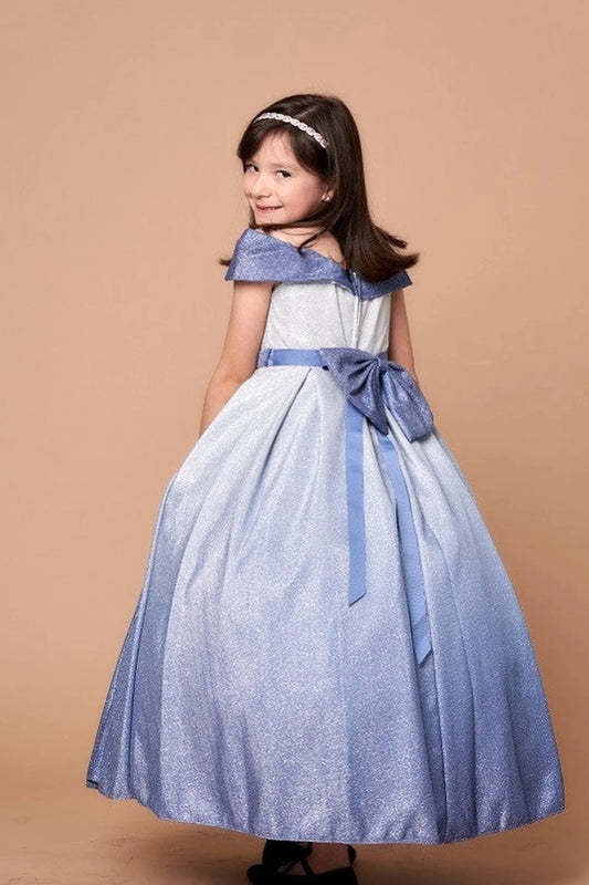 In full view, the Blue/Silver mini quince dress showcases two-tone metallic ombre skirt and off-the-shoulder neckline with an oversized back bow.