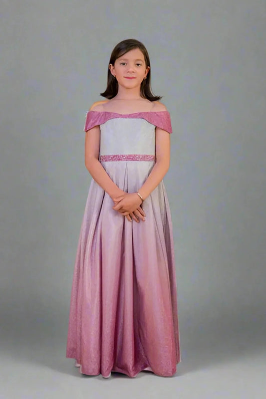 A graceful front view, the Pink/Silver mini quince dress showcases two-tone metallic ombre skirt and off-the-shoulder neckline with an oversized back bow.