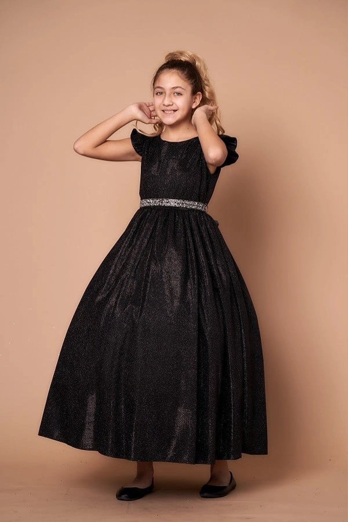 Rich texture defines, the Black mini quince dress showcases metallic full-length party silhouette and ruffle sleeves with a removable rhinestone belt.