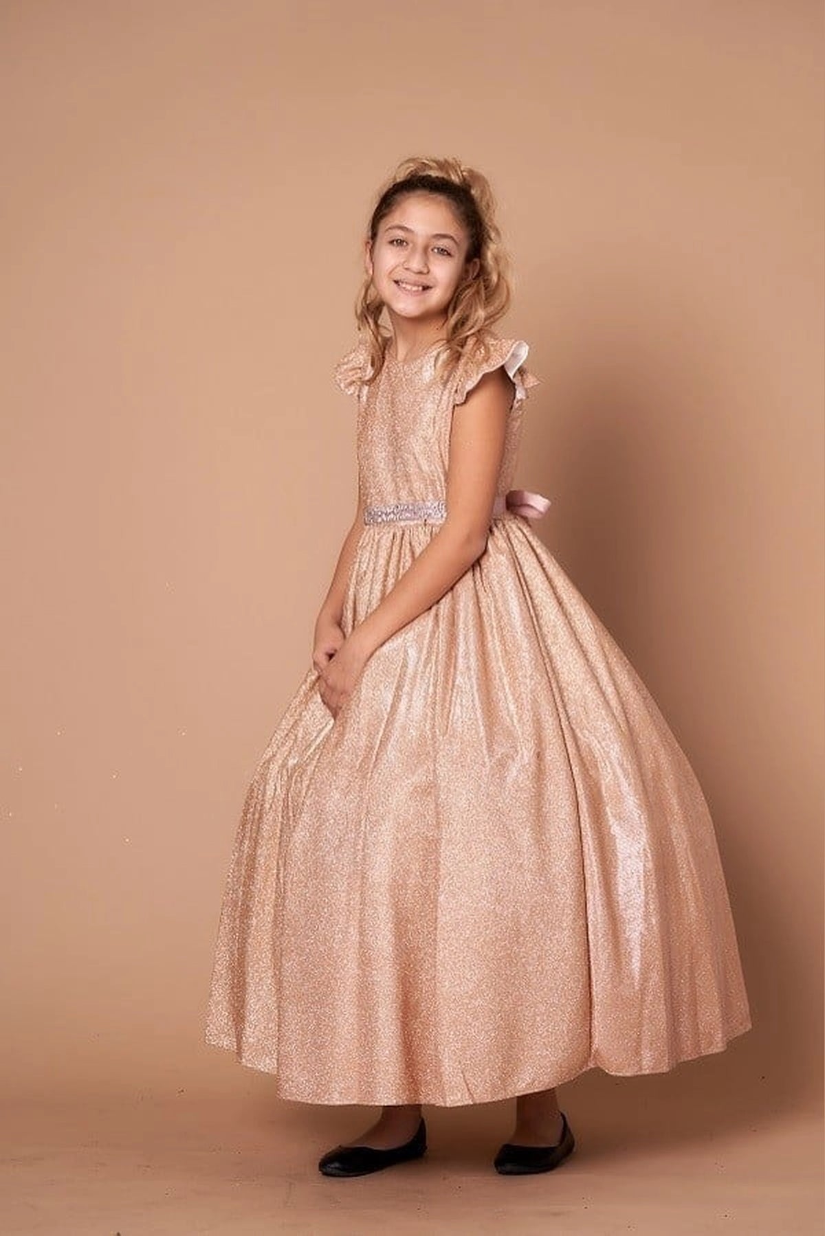 Sparkling details shape, the Champagne mini quince dress showcases metallic full-length party silhouette and ruffle sleeves with a removable rhinestone belt.