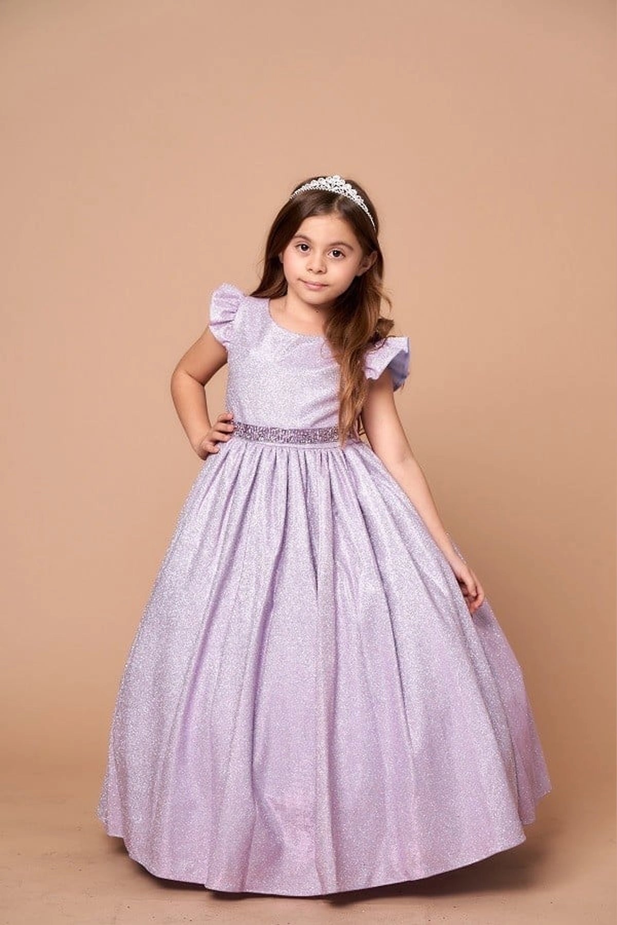 A closer look shows, the Lilac mini quince dress showcases metallic full-length party silhouette and ruffle sleeves with a removable rhinestone belt.