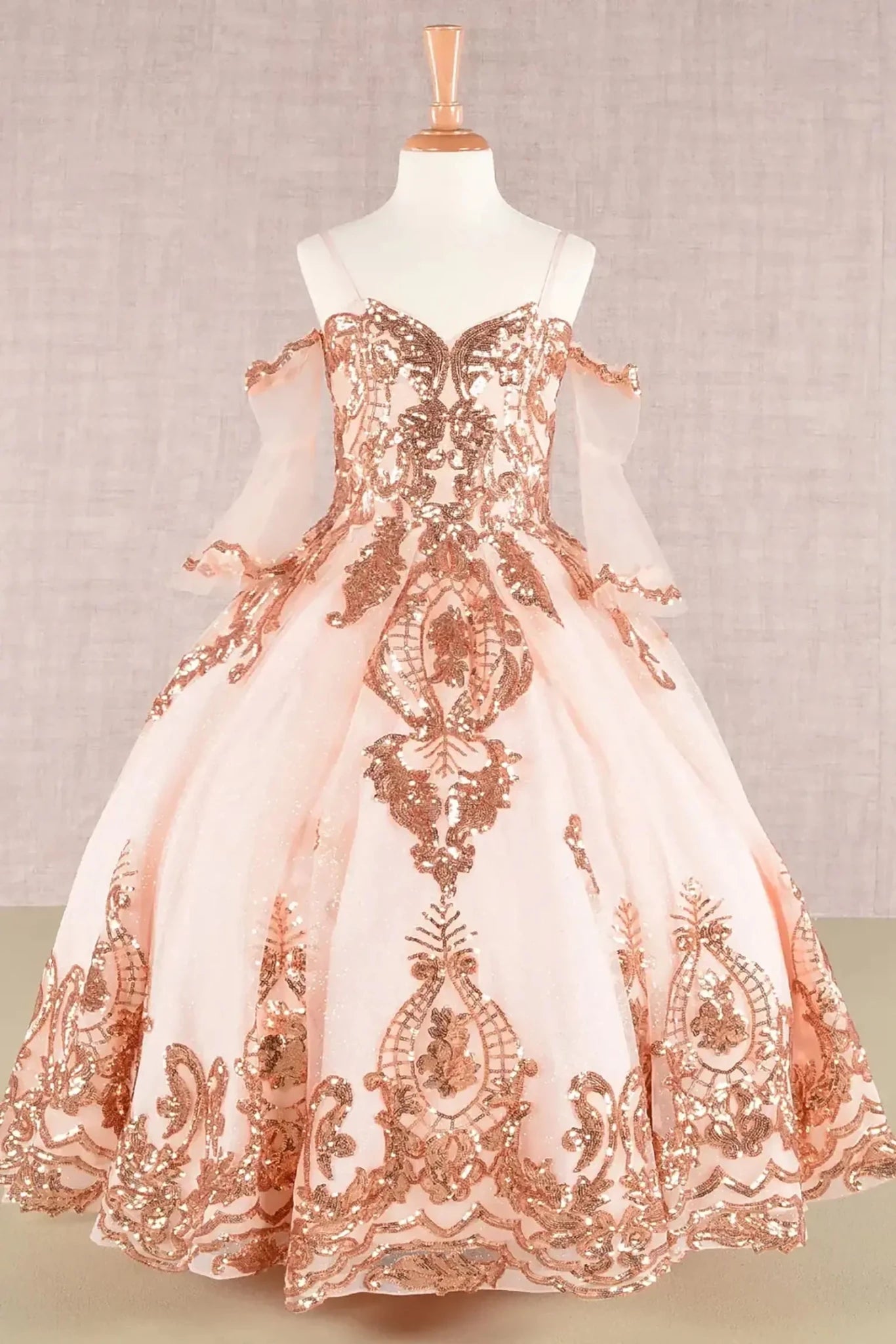 Front view of kids mini quinceañera mini quince dress featuring a glitter sequin mesh bodice, sparkling tulle skirt, and detachable three-quarter sleeves.