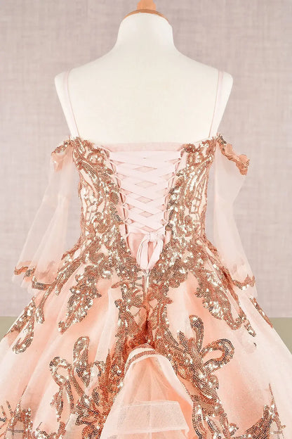 Back zoom view of a champagne glitter sequin embellished mesh 3 años kid dress highlighting glitter fabric and separate mesh 3/4 sleeves