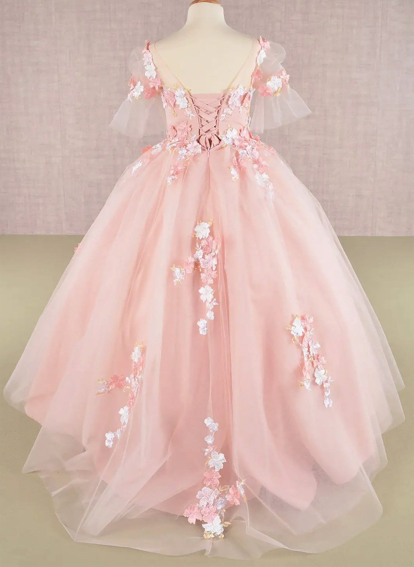 Back blush kid ballgown with 3D floral applique, puff sleeves, and long back hem