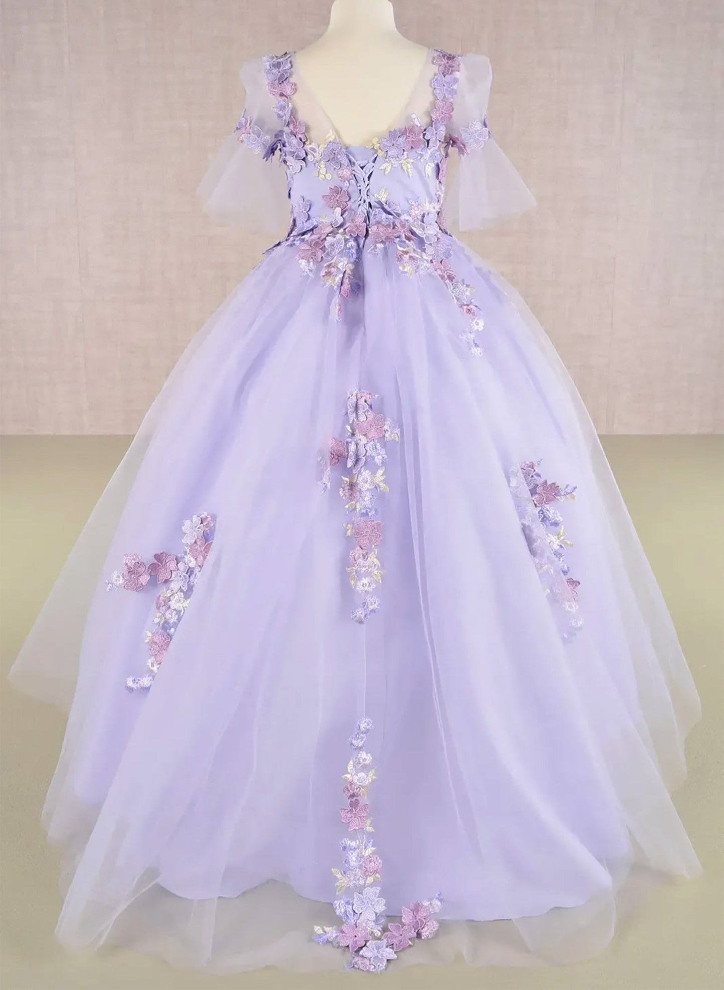Back lilac kid ballgown with 3D floral applique, puff sleeves, and long back hem