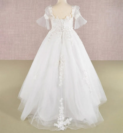 Back view off-white kids mini quinceañera ball gown with 3D floral appliques, puff sleeves and dramatic sweep train and lace back up