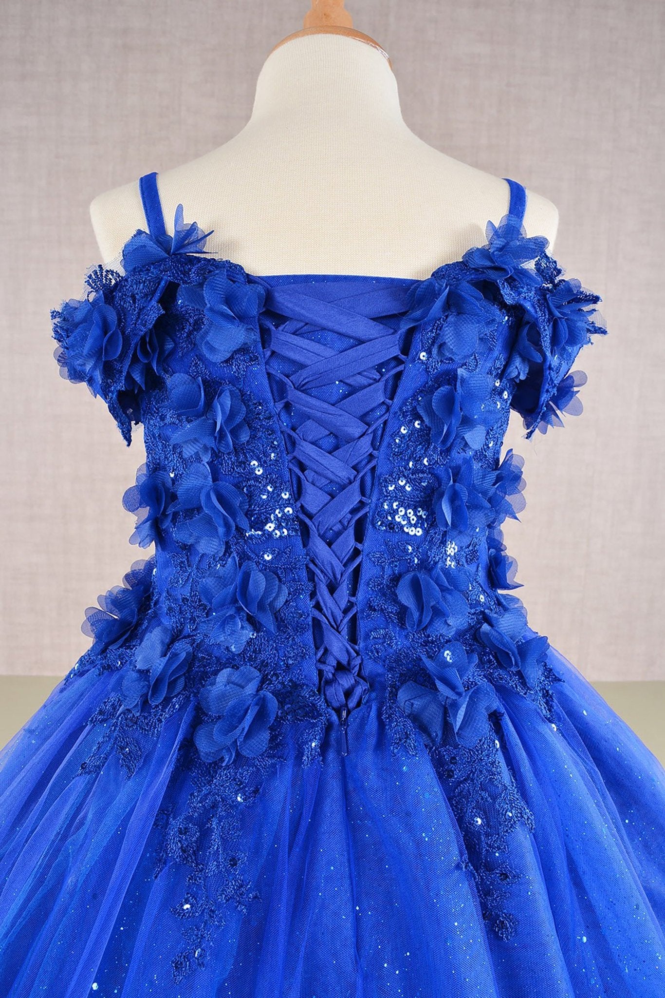 Close-up of blue Royal Blue Kids Dress with 3D Floral Applique and Glitter Embroidery Mesh, Mini Quince Dress.
