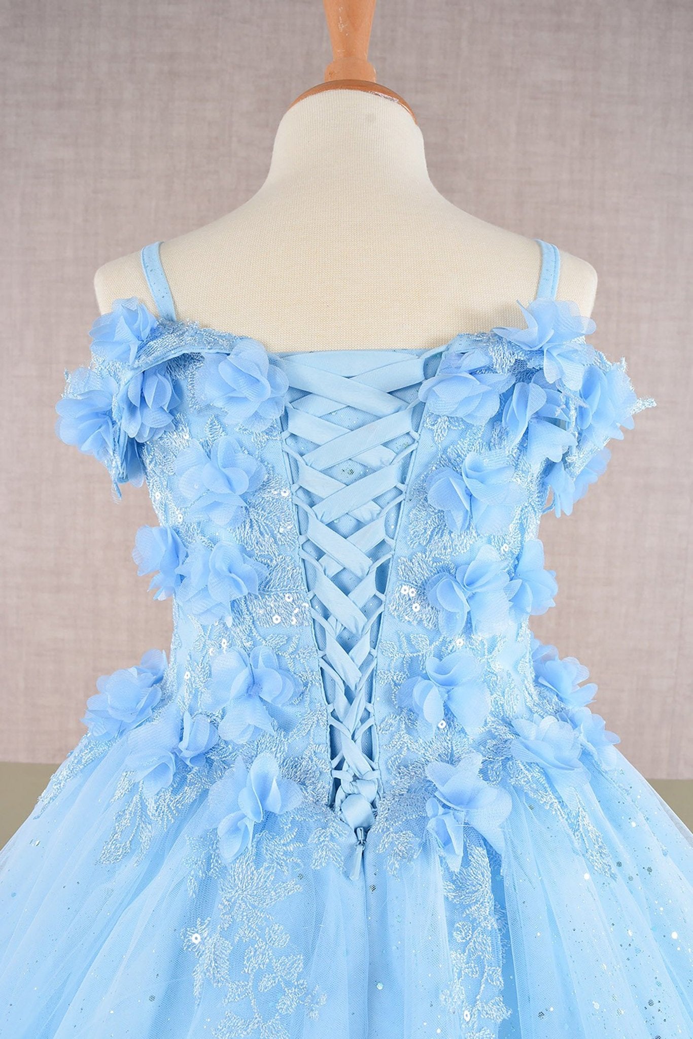Close-up of blue Baby Blue Kids Dress with 3D Floral Applique and Glitter Embroidery Mesh, Mini Quince Dress.