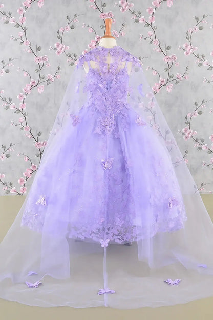 Back view of a lilac kids ball gown with 3D butterflies, sequins, and detachable mesh cape