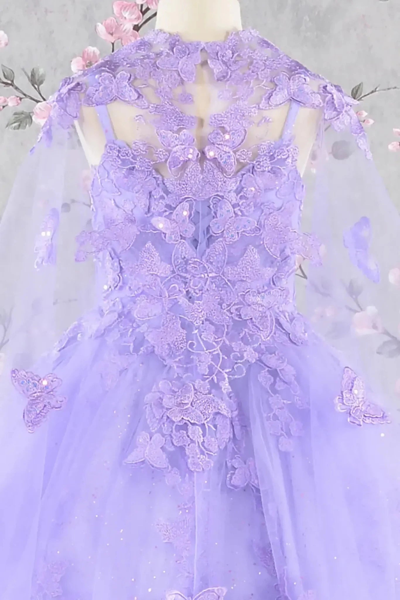 Zoom view lilac lace mini quince dress highlighting lace texture and embellishments.