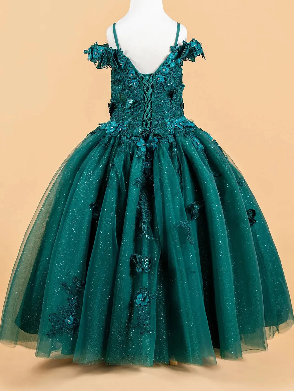 Green sequin mini quince dress displayed.