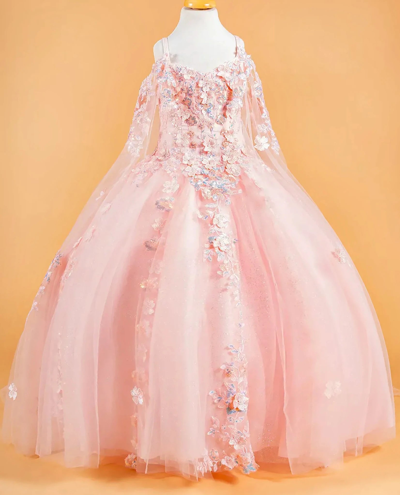 Blush kids floral dress displayed on a mannequin