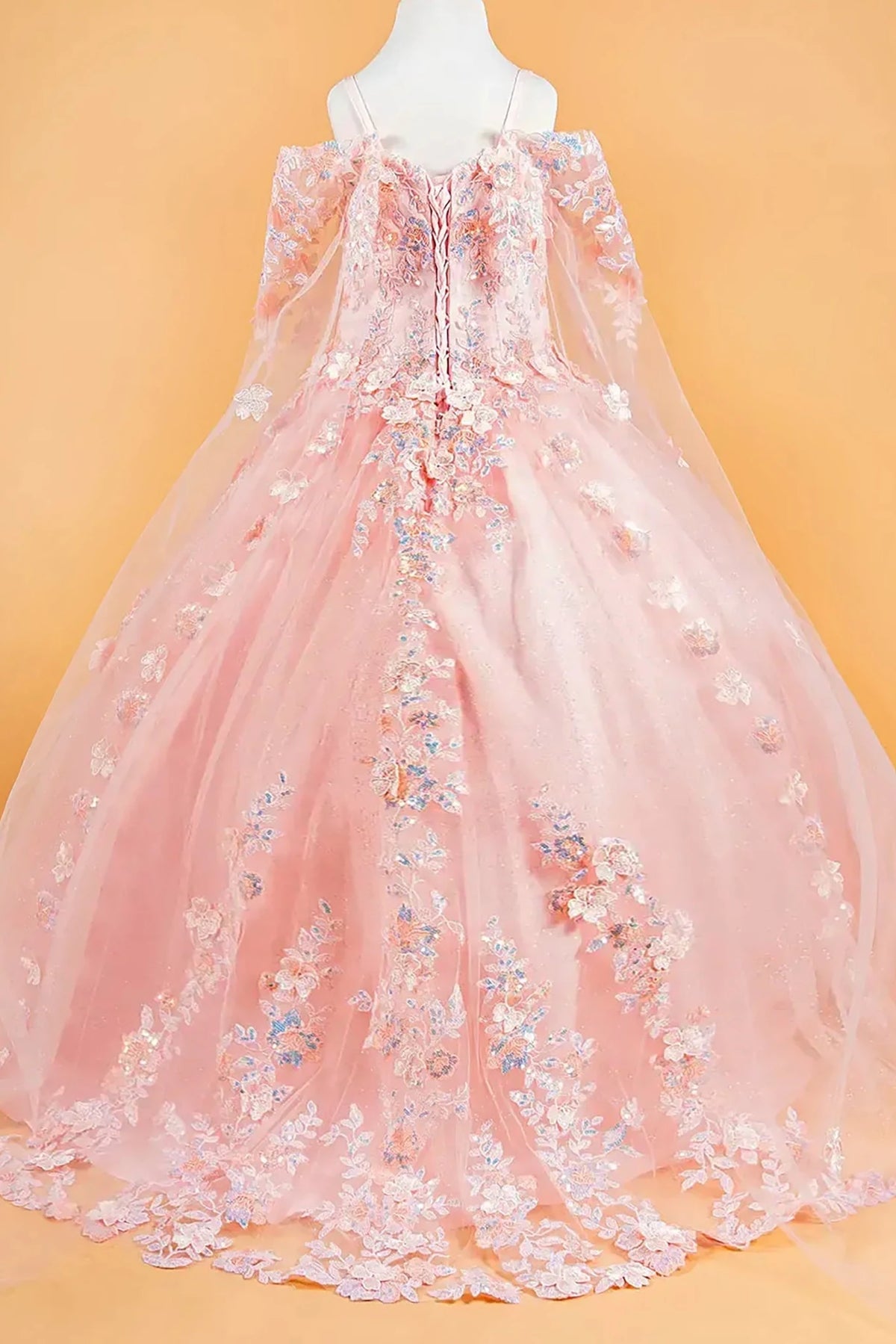 Blush kids floral mini quince dress with long lace sleeves, floral appliques, and a flowing train.