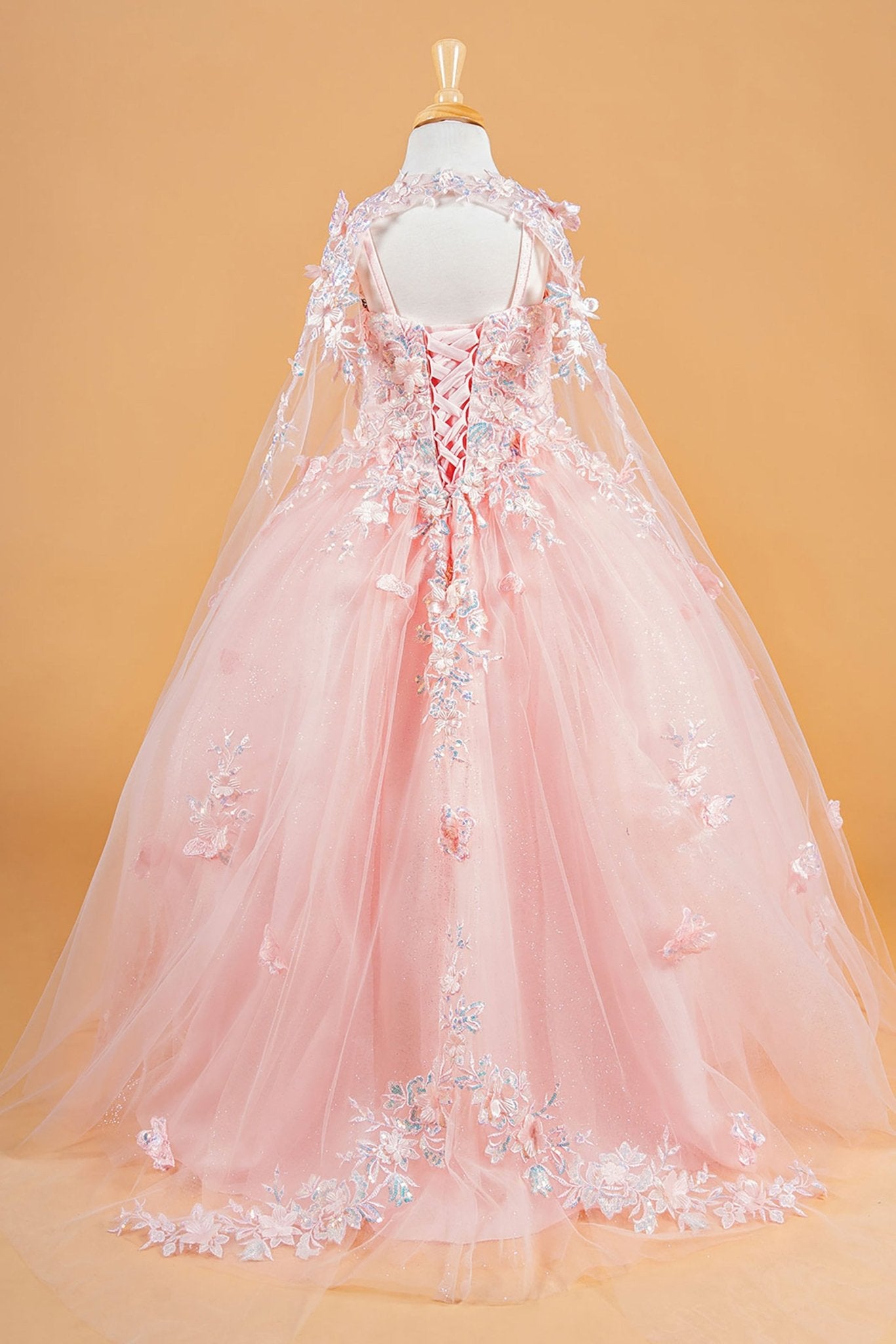 Back blush kids mini quinceañera mini quince dress with 3D flower and butterfly appliques and matching tunic.