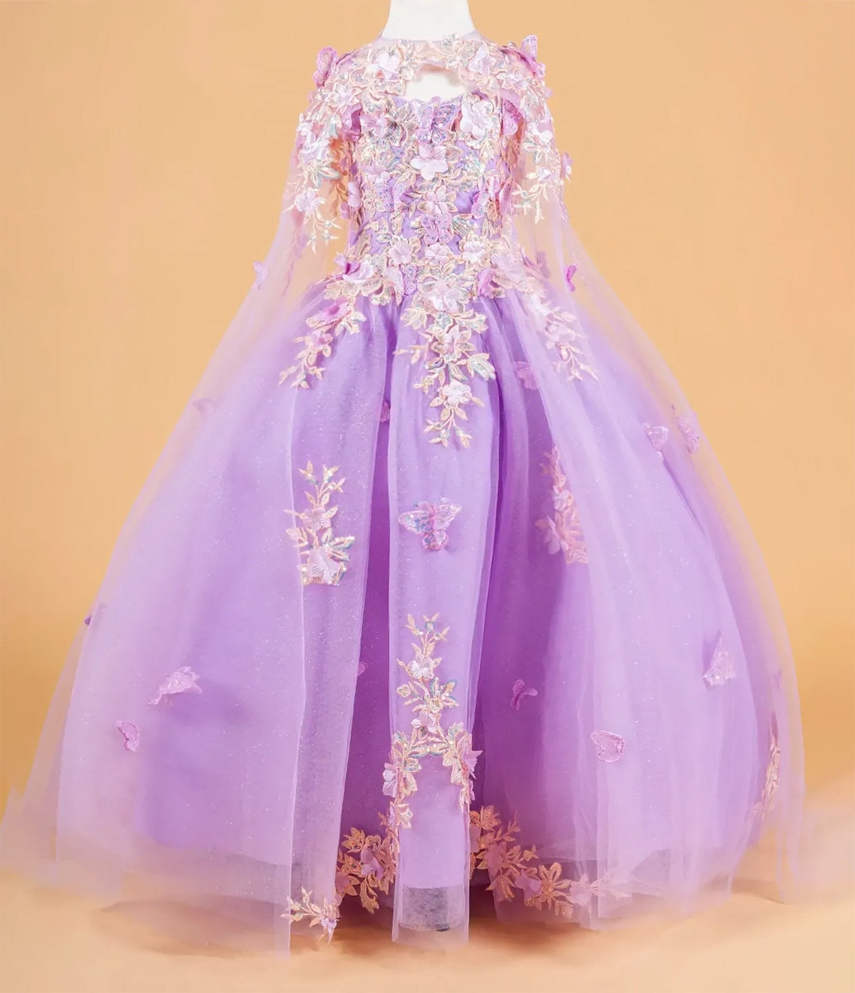 Lilac kids mini quinceañera mini quince dress with 3D flower and butterfly appliques and matching tunic.