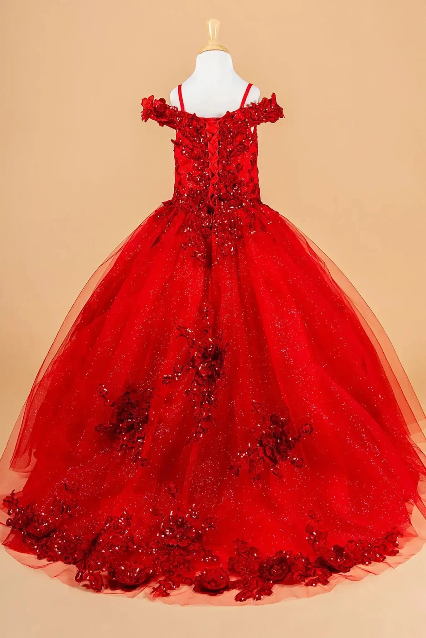 Red kids mini quinceañera mini quince dress with 3D floral applique bodice, boat neckline, cold shoulder sleeves, and glitter tulle layered skirt.
