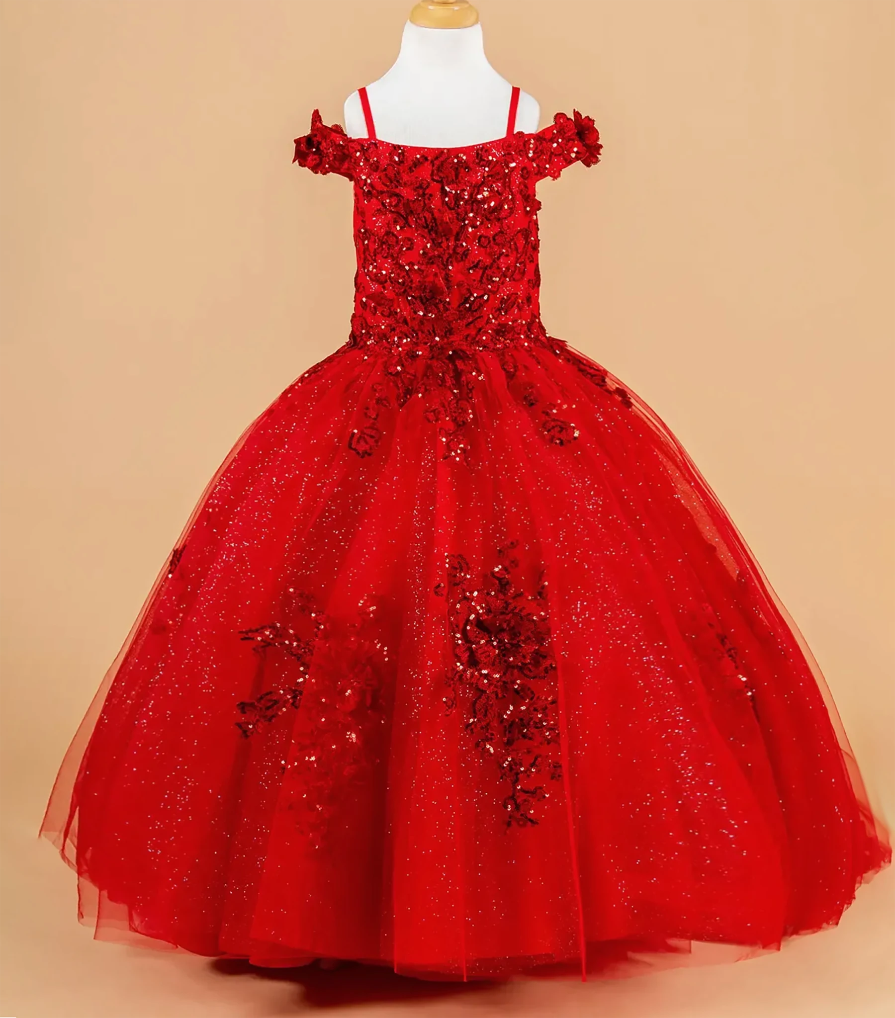 Red kids mini quince dress with floral embellishments.