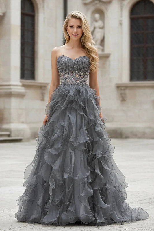 Full-length front view shows beaded strapless styling on the Silver prom evening dress.