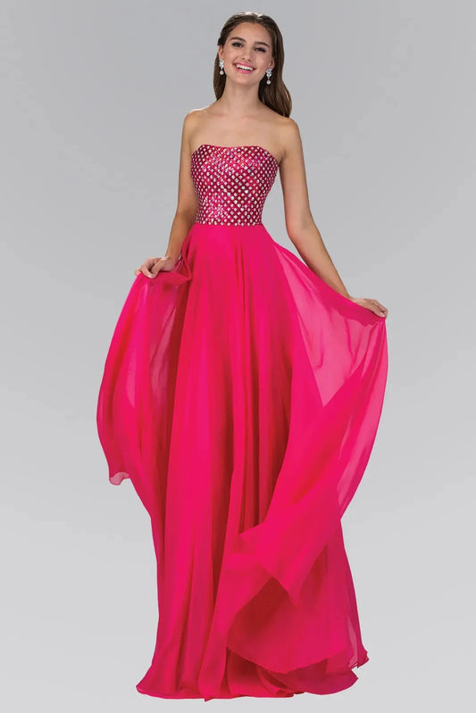 Full-length front view shows beaded strapless styling on the Fuchsia prom evening dress.