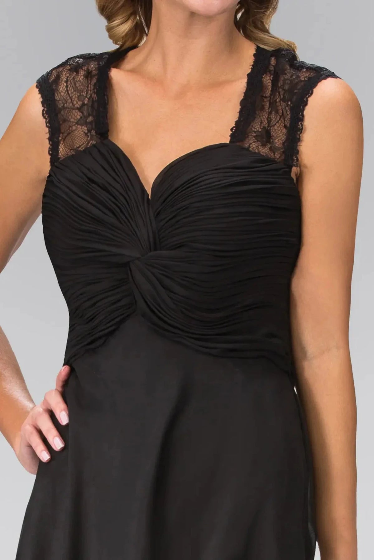 Bodice close-up reveals ruching and lace across the v-neck upper bodice of the Black prom evening dress.