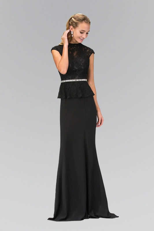 Full-length view highlights black embellished formal dress.