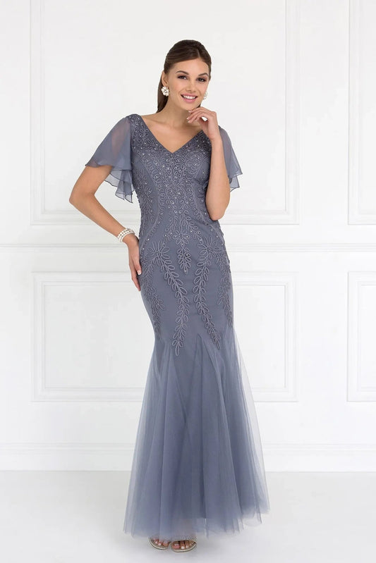 Bodice close-up highlights silver embellished embroidery formal dress.