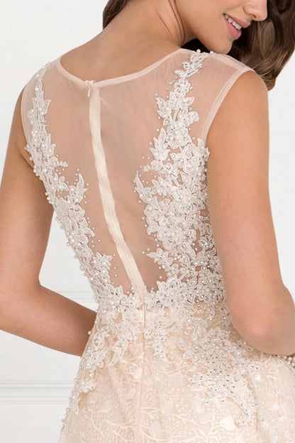 Full-length view highlights champagne beading embellished formal dress.