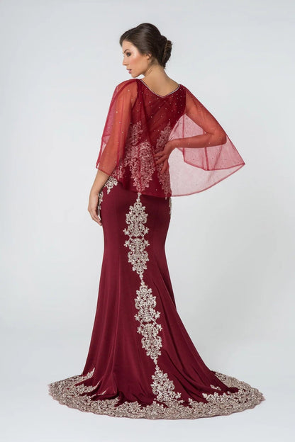 Rear view reveals burgundy embellished embroidery formal dress.