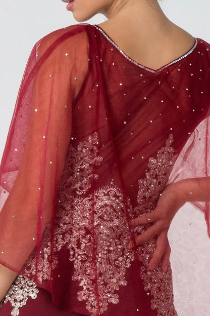 Side profile shows burgundy embellished embroidery formal dress side detail.