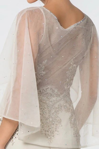 Back detail shows champagne embellished embroidery formal dress back bodice detail.