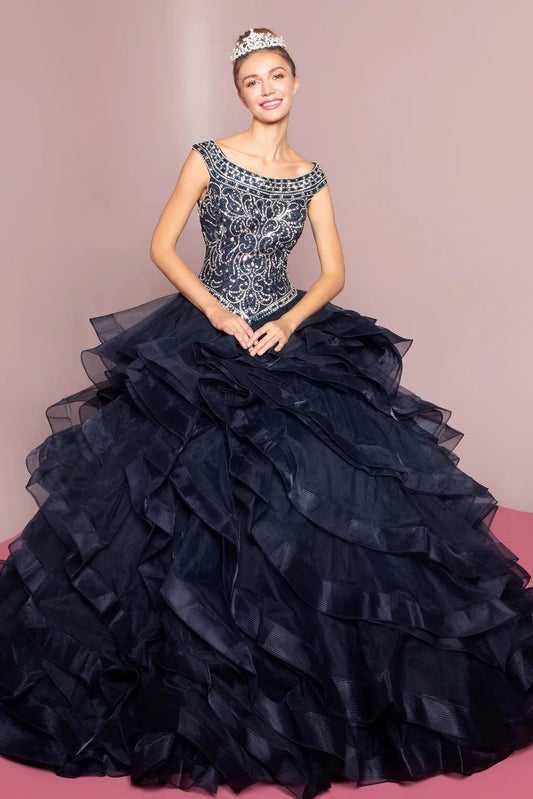 The Navy quinceañera ball gown appears head to toe with a silver-beaded scoop bodice and deep navy ruffles.