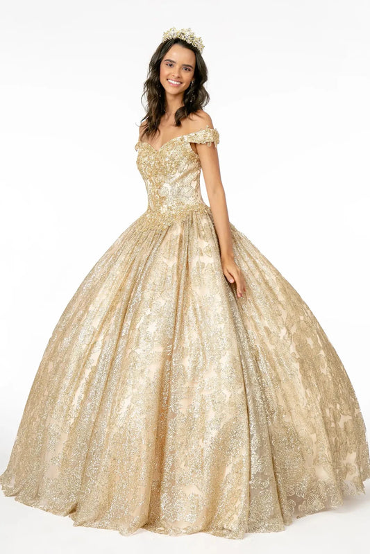 Displayed in full, the Champagne quinceañera ball gown features an off-shoulder sweetheart bodice and shimmering patterned skirt.