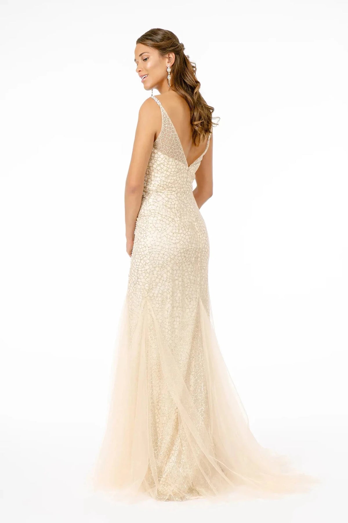 Rear view highlights the open back of the Light Gold prom evening dress.