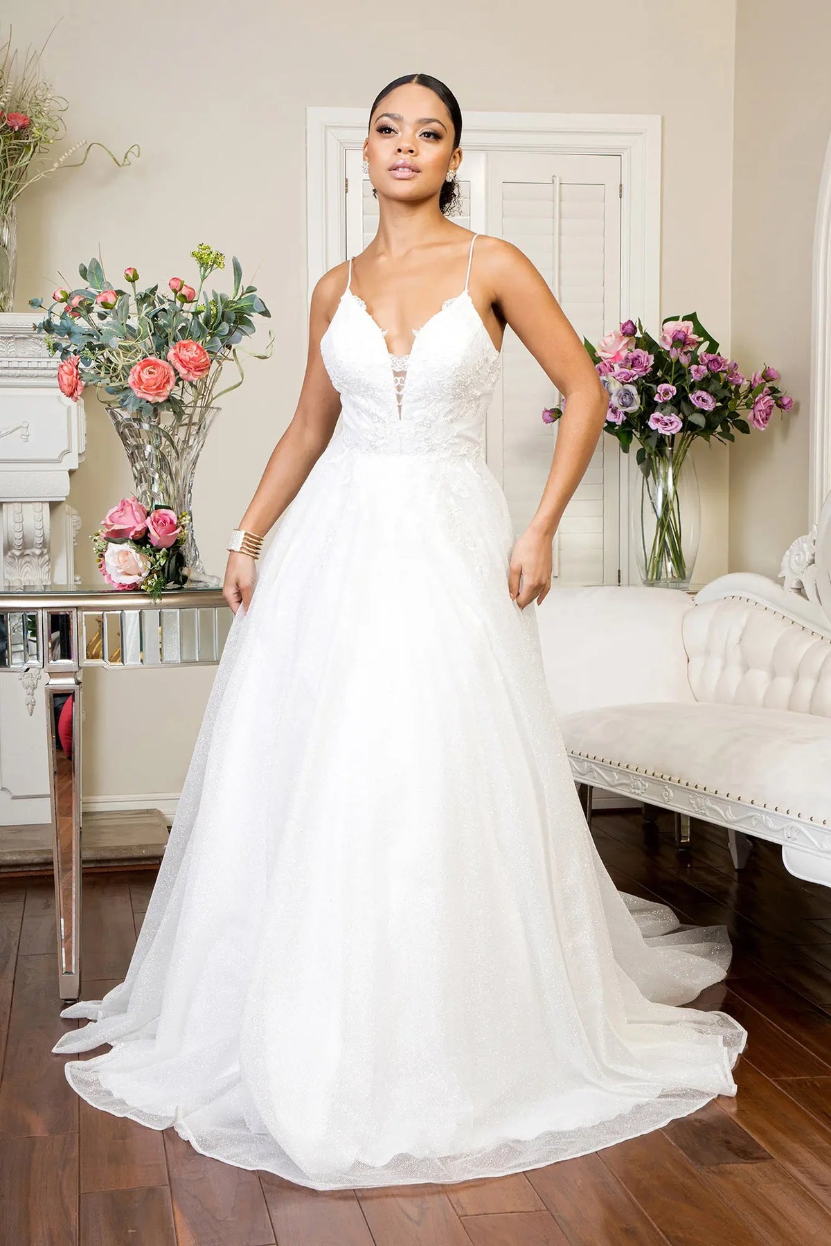 Ivory wedding gown with a delicately embroidered bodice and airy A-line skirt.