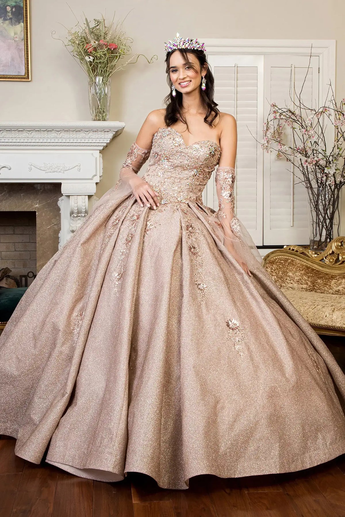 Full-length view presents the Rose Gold quinceañera ball gown with ruffled train.