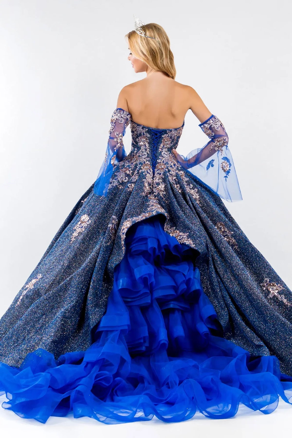 Lace-up back reveals the Royal Blue quinceañera ball gown with lace-up back and detachable mesh sleeves.